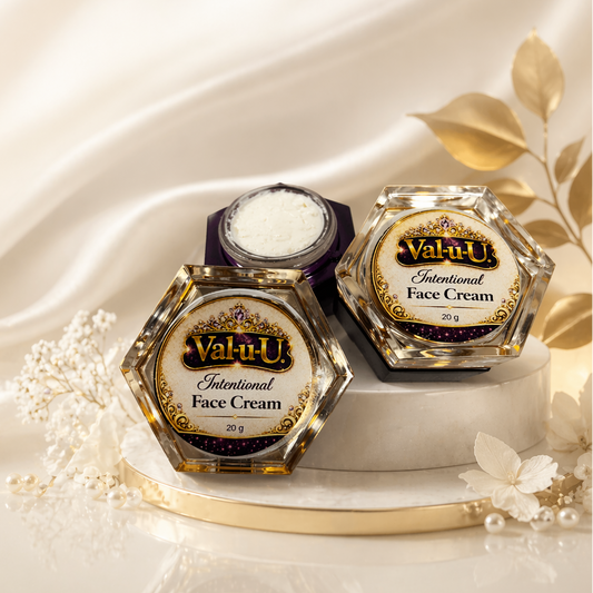 Two jars of Valu-U Intentional Face Cream on a white fabric background with gold accents.