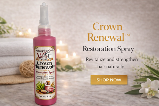 ValuU Crown Renewal Restoration Spray bottle on a wooden surface with candles and flowers in the background.