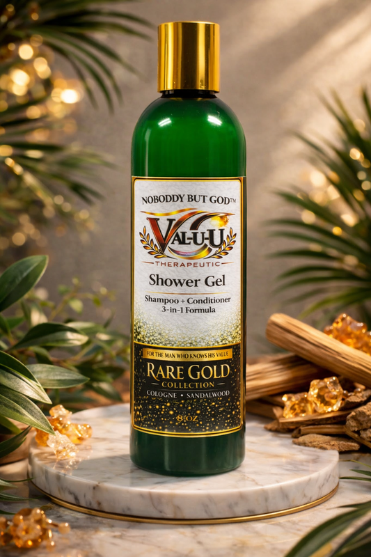 Bottle of Valu Therapeutic Shower Gel with gold cap on a marble surface with decorative elements.