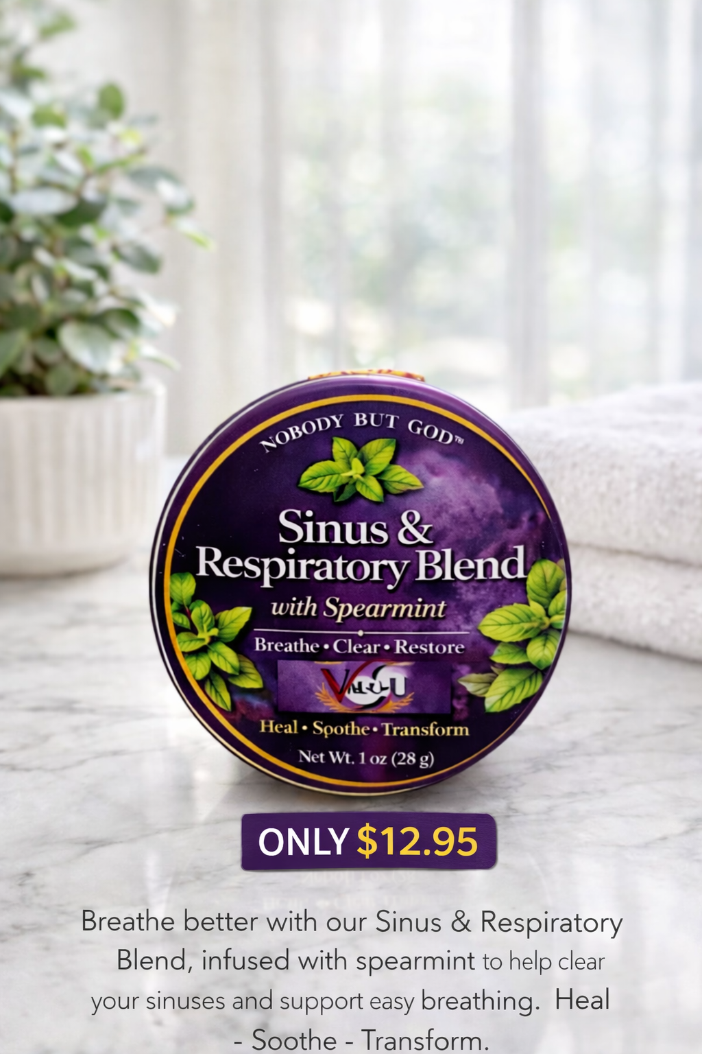 Nobody But God Sinus & Respiratory Blend with Spearmint packaging on a marble surface with a plant in the background.