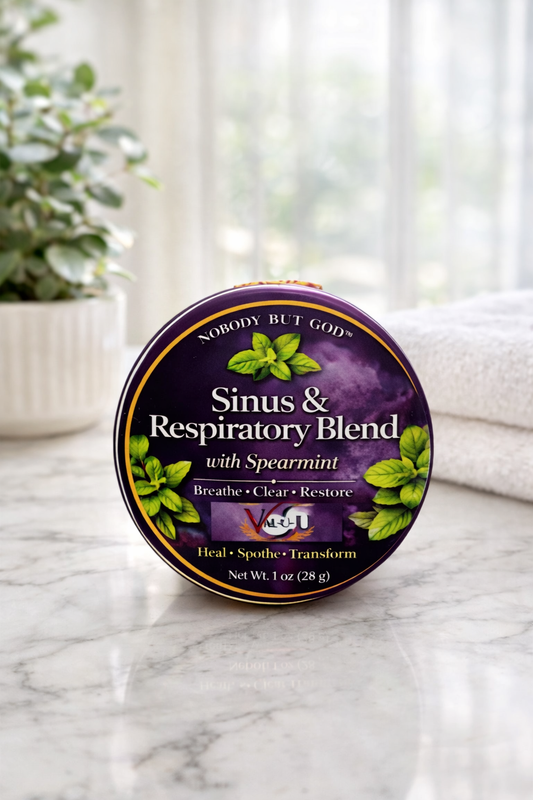 Tin of 'Sinus & Respiratory Blend' with spearmint on a marble surface.