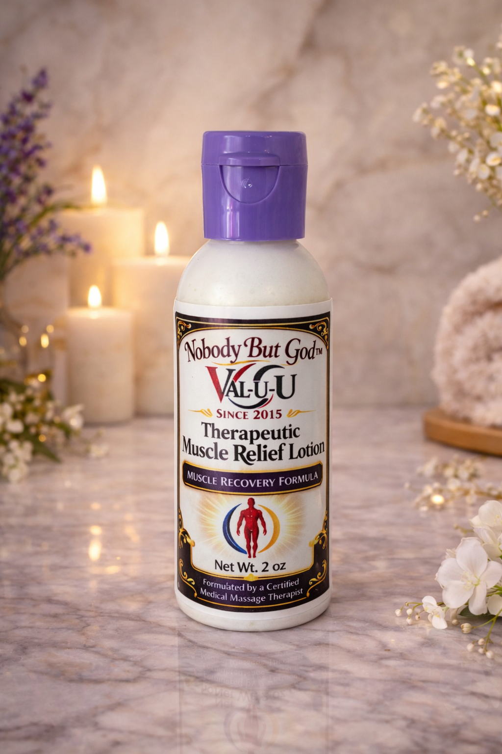 Bottle of 'Nobody But God' Valu-U Therapeutic Muscle Relief Lotion on a marble surface with decorative candles and flowers.