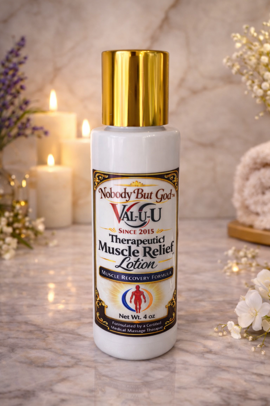 Lotion bottle with gold cap on a marble surface with candles and flowers in the background