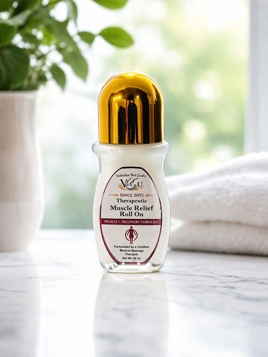 Therapeutic Muscle Relief Roll On bottle on a marble surface with a blurred natural background