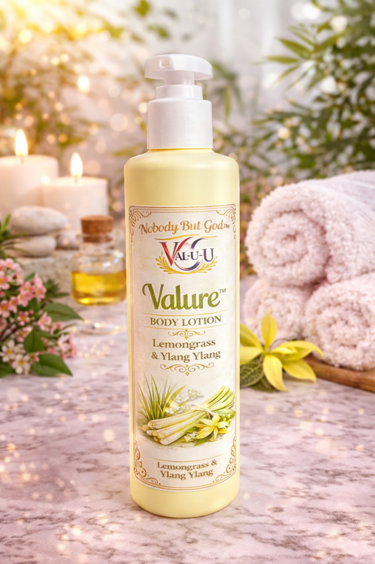 Valu-U Lemongrass & Ylang Ylang body lotion bottle on a decorative background with candles and flowers.